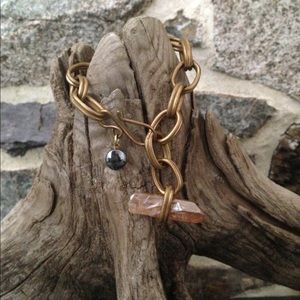 Gold tone link and crystal bracelet